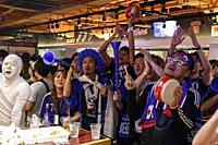 Soccer fans react as they watch the FIFA World Cup Group H match between Poland and Japan at Hooters restaurant in Shibuya on June 29, 2018, Tokyo, Ja...