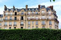 Haussmannian building facade in a sunny day. Paris, France.