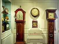 Longcase and other antique clocks on display at the premises of Carter Marsh and Co. in Winchester, England (Permission to photograph kindly given by ...