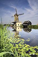 Windmill the Vriendschap along the river Graafstroom in the Dutch village Bleskensgraaf.