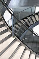Knife edge stair revolutions in glass and chrome spiralling downwards at the Roman Museum, Nimes, Provence, France.