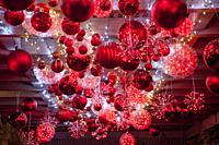 Huge Christmas tree balls shimmer in the ruby glow display in Newport Beach, CA. .