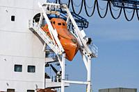 Rotterdam, Netherlands - April 17, 2018: An Unsinkable, totally enclosed, free-fall lifeboat made of plastic, on angled launch platform at the rear of...