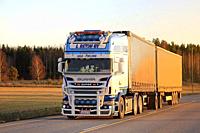 Salo, Finland - November 18, 2018: Customized super Scania R500 truck of L Retva Oy transports goods along highway at sunset time in autumn.