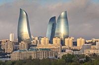 Azerbaijan, Baku, city skyline with Flame Towers form Baku Bay, dawn.