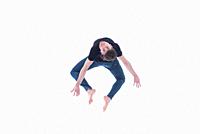 Casual dressed contemporary dancer on white background.