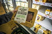 A shopper chooses a package of Beyond Meat from a freezer in a supermarket in New York on Monday, November 19, 2018. The plant-based protein start-up ...