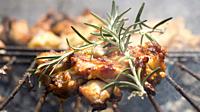 Grilled Deboned Chicken Meat On Smoking Barbecue With Rosemary.