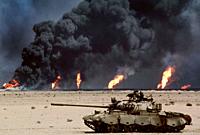 IRAQ - 1990 - An abandoned Russian-made tank in the desert in front of burning oil wells, images like these became an icon of the first Gulf War in 19...