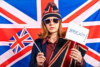 British redhead woman with UK flag and Brexit banner.