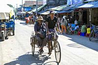 Myanmar (formerly Burma). Kayin State (Karen State). Hpa An. Couple driving a rickshaw