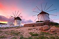 Old traditional windmills over the town of Mykonos. .