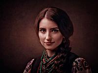 Beauty female portrait with ethnic ukrainian dress and accessories.