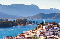 View of Poros island and mountains of Peloponnese peninsula in Greece. .