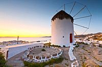 Traditional windmill over the town of Mykonos, Greece. .