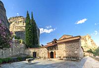 Panoramic view of the Assumption of Virgin Mary byzantine church in Meteora, Kalambaka town in Greece, on a sunny summer day.
