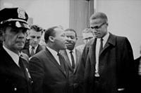 USA -- 26 Mar 1964 -- Martin Luther King and Malcolm X waiting for a press conference to begin -- Picture by Marion Trikosko / Lightroom Photos.