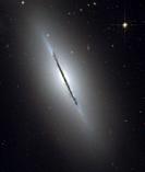 GALAXY NGC 5866 -- Feb 2006 -- This is a unique view of the disk galaxy NGC 5866 tilted nearly edge-on to our line-of-sight. Hubble's sharp vision rev...