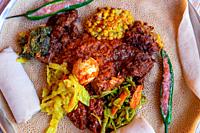 Injera served with Chicken and egg Doro Wat, berbere, vegetables and lentils. Injera, the national dish of Ethiopia, is a sourdough flatbread made fro...