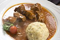 Beef goulash with dumpling South Tirol Italy.