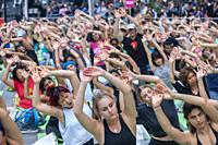 Thousands of yoga practitioners pack Times Square in New York to practice yoga on the first day of summer, Friday, June 21, 2019. The 17th annual Sols...
