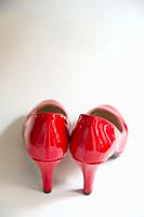 Pair of red high heeled shoes.