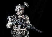 US marine riders shooter, army special forces soldier standing in darkness in mask, battle uniform, quad-tube, four lenses night vision goggles on hel...