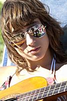 girl playing the guitar, location tarragona, catalonia, spain.