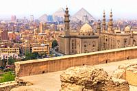 Cairo view, the Mosque-Madrassa of Sultan Hassan and the Pyramids, Egypt.