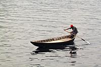 Bangladesh â. “ January 06, 2014: Boatmen carry passengers in foggy winter afternoon on River Buriganga.