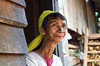 Head portrait of a Kayan Lahwi woman who has removed her brass neck coils . The Long Neck Kayan (also called Padaung in Burmese) are a sub-group of th...