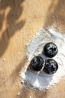 Heart armed by sugar-free sweetener granules blueberry trio container on a wooden board to make desserts with heart.