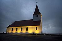 Sunrise view of the church of Vík (vikurkirkja), built in the 1930s, rises above the town of Vík in southern Iceland.