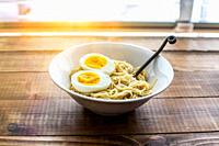 Ramen noodle with eggs and sunbeam from outside.