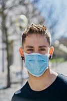 Caucasian male with medical masks as a defense against a virus. Coronavirus concept.