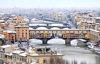 Ponte Vecchio or Old Bridge Florence Italy with snow panorama Tuscany.