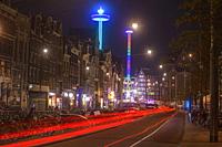 Street scene (Damstraat) at night, Amsterdam, North Holland, Netherlands.