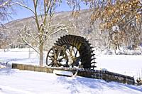 Old water wheel of an historic water mill, Schmiechtal valley near Ulm, Germany.