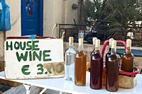 selling homemade wine bottles with price a small town on the island of santorini.