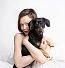 Portrait of a Woman with Brown Hair and her Dog.