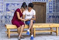 Young Uzbeks in a moment of intimacy. Khiva, Uzbekistan.