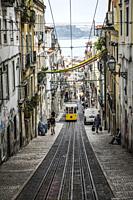 Famous retro yellow tram on the street in Lisbon city, Portugal.