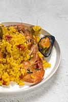Traditional rice in paella with fish and meat. Typical Spanish.
