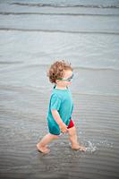 2 years old boy playing at the Beach in the Baltic Sea.