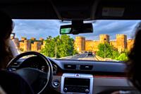 The medieval walls of Avila from a moving car, Spain.