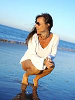 young girl enjoying comfortable morning clothes on the Islantilla beach, Huelva