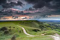Scattered clouds over the Fulking village and views towards truleigh hiill and the sea on the South Downs National Park from Devil's Dyke, Sussex, Eng...