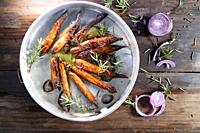 Photographic reproduction of a portion of carrots roasted in the oven.