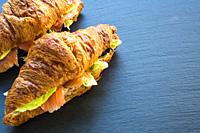 Croissant with lettuce, smoked salmon and avocado.