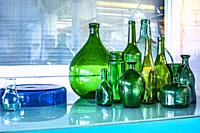 Arranged glass bottles in restaurant Keukenconfessies at Strijp-S, Eindhoven, The Netherlands, Europe.